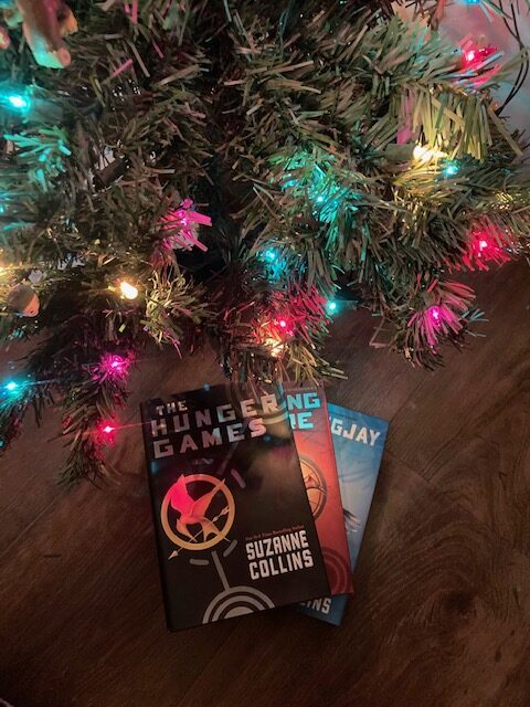 Nothing says Christmas joy to me like snuggling up next to the tree with my favorite trilogy, The Hunger Games. May the odds be ever in my favor for finishing my reading before I fall asleep.