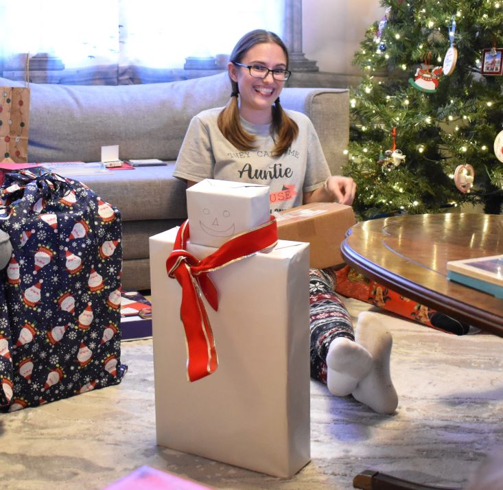 Fun frugal holiday ideas for jazzing up Christmas presents for young kids - building a snowman from the boxes.