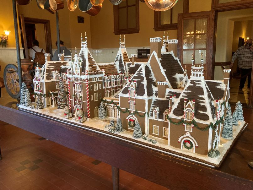 A picture of the Biltmore Estate gingerbread replica around the holidays, a frugal vacation splurge.